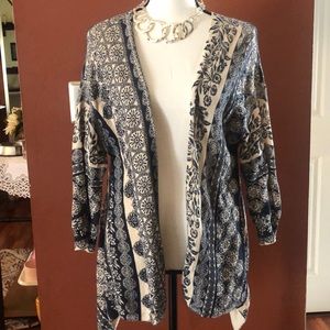 Woman’s blue/cream cardigan